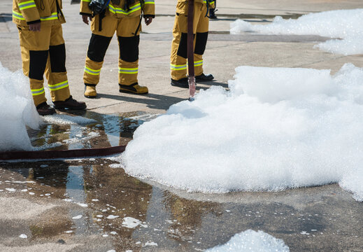 Firefighters practice building fire response plans using foam.