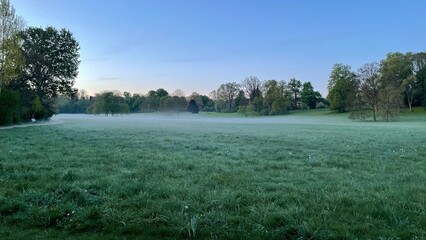 Sunrise and fog at dawn 5:00 AM end of April, Tiefurt Park in Weimar, Germany