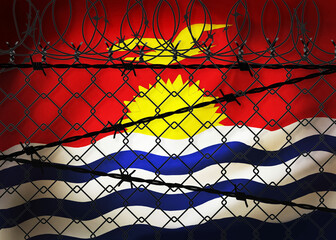 Kiribati flag behind barbed wire and metal fence