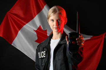Female police officer with walkie-talkie and flag of Canada on dark background
