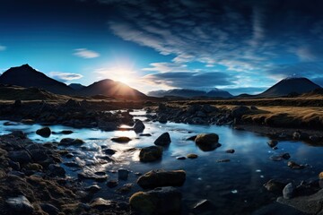 Serene mountain landscape with a stream and sunset