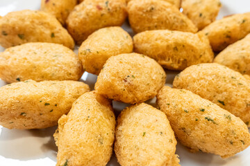 traditional appetizer of the portuguese gastronomy made with codfish, bolinhos de bacalhau