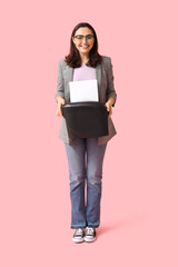 Fototapeta premium Secretary with shredder on pink background