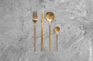 Beautiful cutlery set on grey table, flat lay