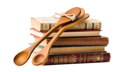 A wooden spoon rests atop a stack of books