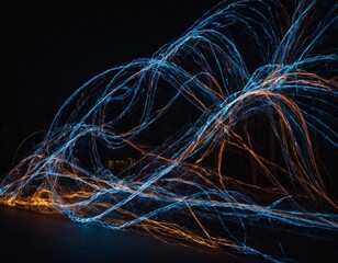 Light painting art creating mesmerizing patterns and shapes in the dark.
