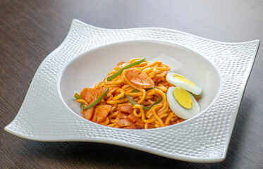 Stir-fried noodles with sausage and egg