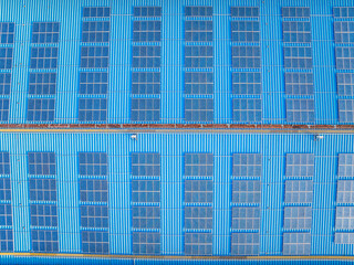 Aerial view of neatly arranged solar panels on the roof