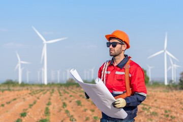 Male man engineer inspection posing check control wind power machine in out door wind energy...