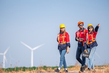 engineer team inspection check control wind power machine construction installation in wind energy factory. technician professional worker discussion check for maintenance electronic wind turbine - obrazy, fototapety, plakaty