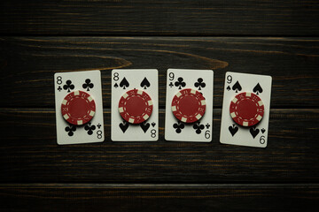 Gambling game of poker with a successful winning combination of two pairs. Playing cards and chips...
