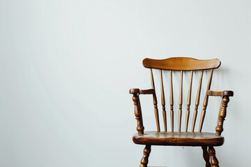 A vintage-inspired Windsor chair positioned against a solid white backdrop, isolated on solid white background.