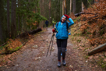 HIkers with backpacks on a trail in a rainy day - 800985055