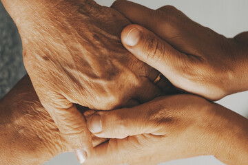 Caring elderly grandma wife holding hand supporting senior grandpa husband give empathy care love,...