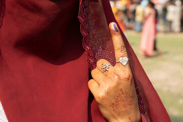 Voter shows inked finger after cast vote