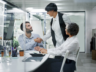 Business people, handshake and meeting with introduction for greeting, hiring or agreement at office. Group of employees shaking hands for b2b, partnership or deal for creative startup at workplace