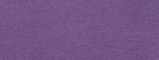 Texture of craft old dark purple color paper background , macro. Vintage kraft violet cardboard.
