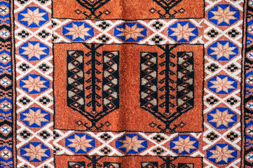 pattern of traditional Arab Uzbek carpet at the oriental bazaar in Tashkent in Uzbekistan in close-up