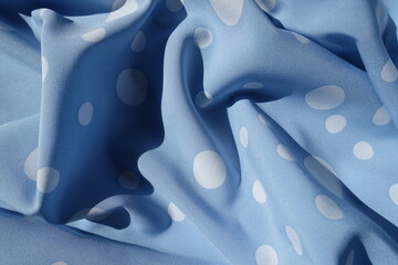Draped light blue rayon fabric with polka dot pattern