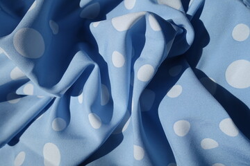 Jammed light blue rayon fabric with polka dot pattern