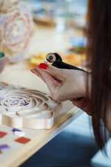 The process of creating a flower from a mosaic. 