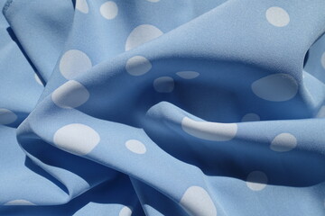 Rumpled light blue rayon fabric with polka dot pattern