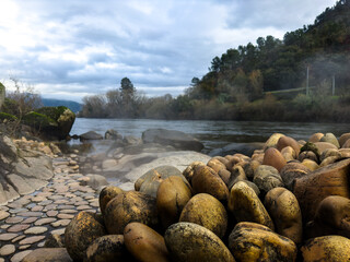 Riverside Hot Spring with Steaming Rocks