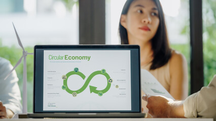 ESG ( environment, social,governance)  circular economy on laptop screen with carbon free chart...