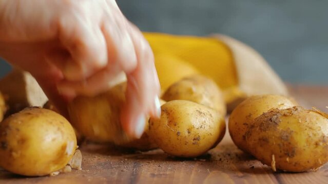 Picking potatoes from the table