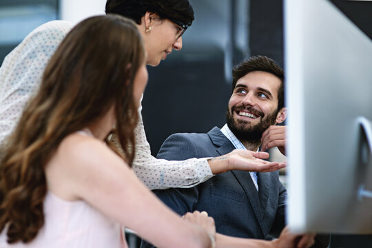 Office, smile and business people with help on computer for training, support and seo planning. Happy, intern and monitor at digital agency with teamwork for web design, consulting and feedback