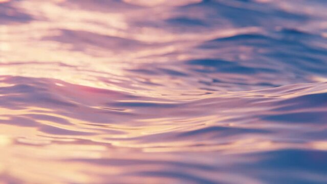 Close-up view of evening ocean waves in slow motion, seamless loop background