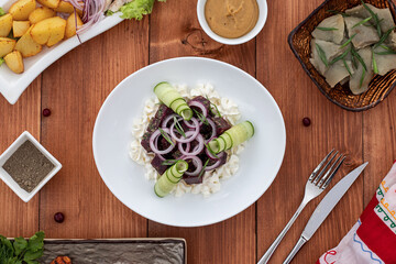 red beetroot vegetable salad on a white plate on the table serving