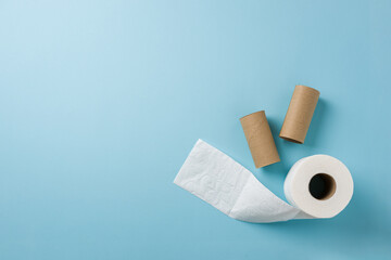 Top view of toilet paper roll on blue background
