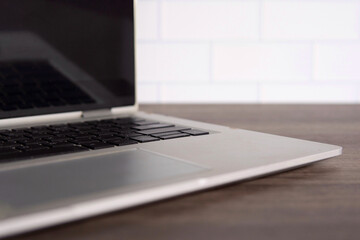 Fototapeta premium Closeup image of laptop on wooden table with copy space.