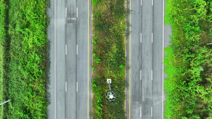 Drone aerial view : Majestic aerial vista of a pristine intercity motorway, gleaming asphalt...