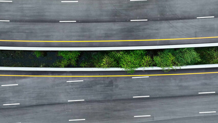 Drone aerial view : Experience the sheer grandeur of the recently unveiled intercity motorway - a pristine, empty thoroughfare - as seen through the eyes of a drone. Transportation concept. 
