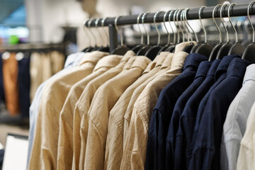 Men's shirts on hangers in a clothing store close-up