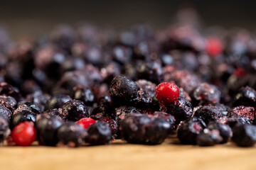 large number of frozen blueberries with red unripe