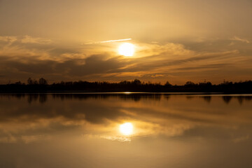 The sky and the lake are red-tinged during sunset