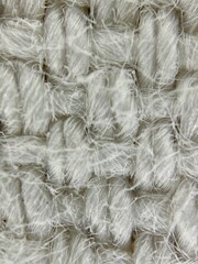 Weave of threads in light fabric, extreme close-up photo