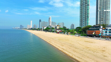 Jomtien Beach, captured by drone, reveals a tranquil coastline kissed by turquoise waters, where...