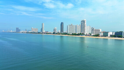 Jomtien Beach, bathed in sunlight and fringed by vibrant flora, epitomizes coastal sophistication....
