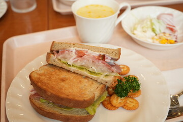 Delicious Prosciutto Ham or Dry-Cured Ham Sandwich made of Toasted Bread, Ham and Lettuce on plate - 生ハム サンドウィッチ 