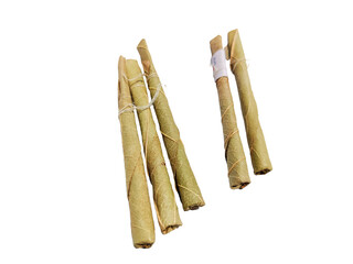 Bidi or Beedi, A beedi is a thin cigarette or mini-cigar filled with tobacco flake and commonly wrapped in a tendu or Piliostigma racemosum leaf tied with a string or adhesive, bidi isolated 