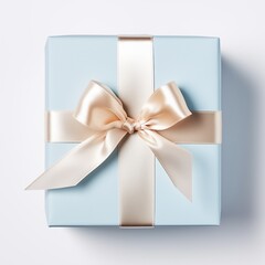 Elegant blue gift box with a luxurious cream satin bow on a light background