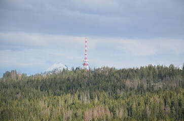 mountains under snow, a beautiful panorama of the High Polish Tatras, Mount Giewont, the green valley below Gubalowka near the city of Zakopane,