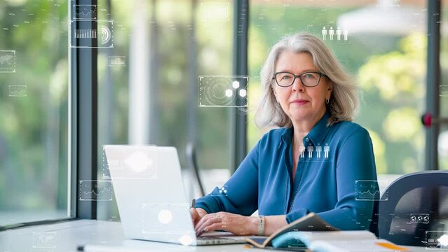 A senior woman executive multitasking with digital tools, exemplifying efficiency and technology in business