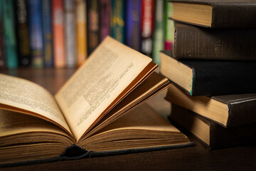 opened book, lying on the bookshelf in library
