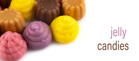 Pile jelly candies in the form of a meringue and cupcake isolated on white