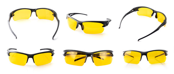Sports and safety glasses made of black plastic with yellow glasses, shot on a white background.